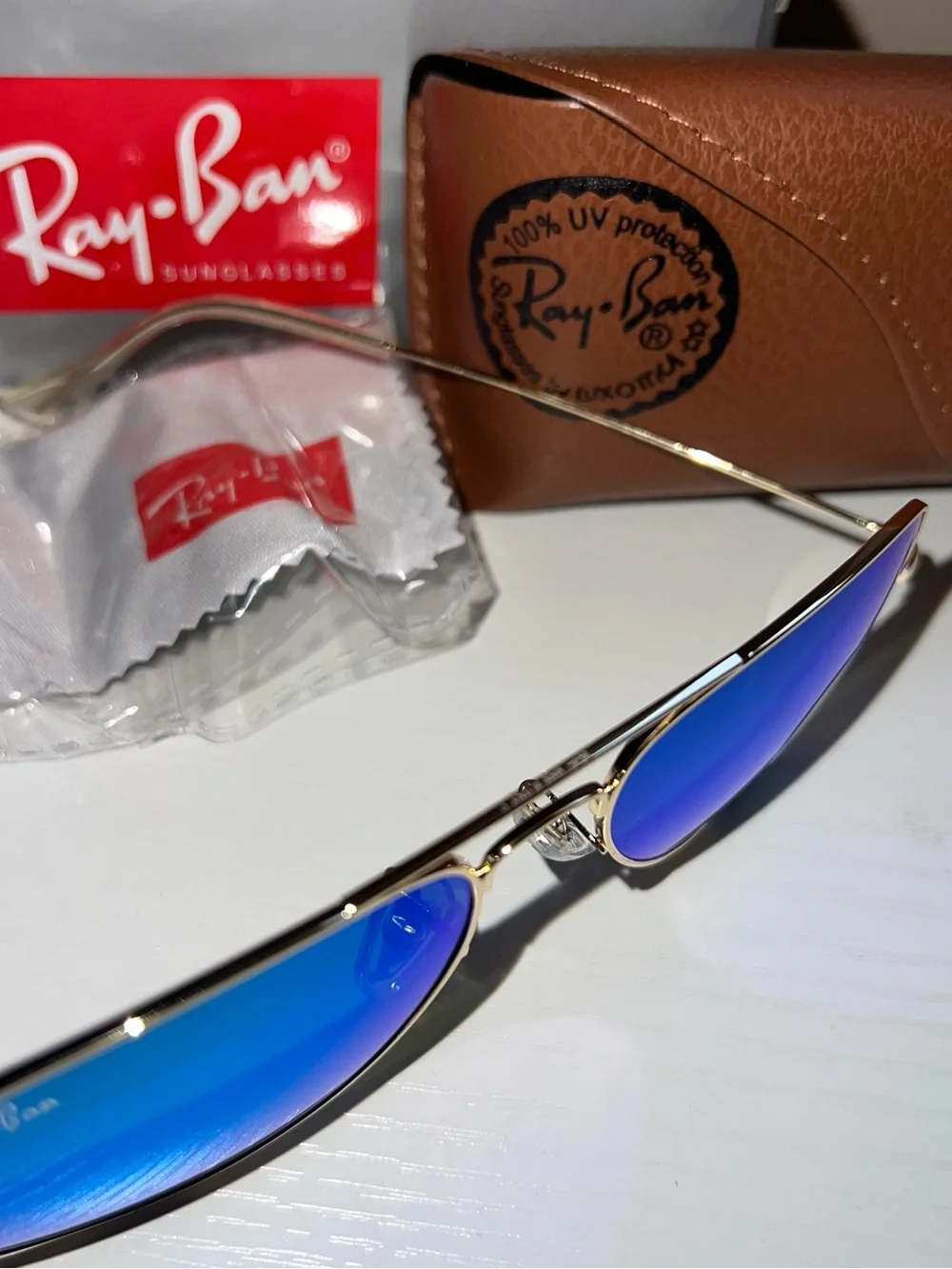 Ray-Ban Gold Frame Sunglasses with Blue Mirrored Lenses